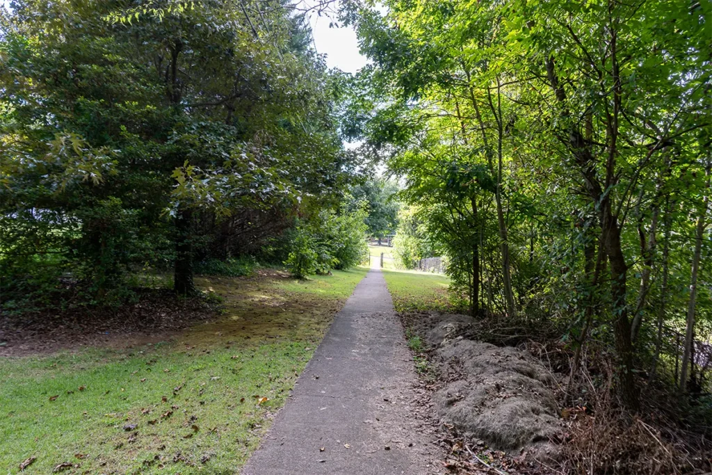 Paved connector entering the Farragut High School campus through a gate in Farragut, Tennessee